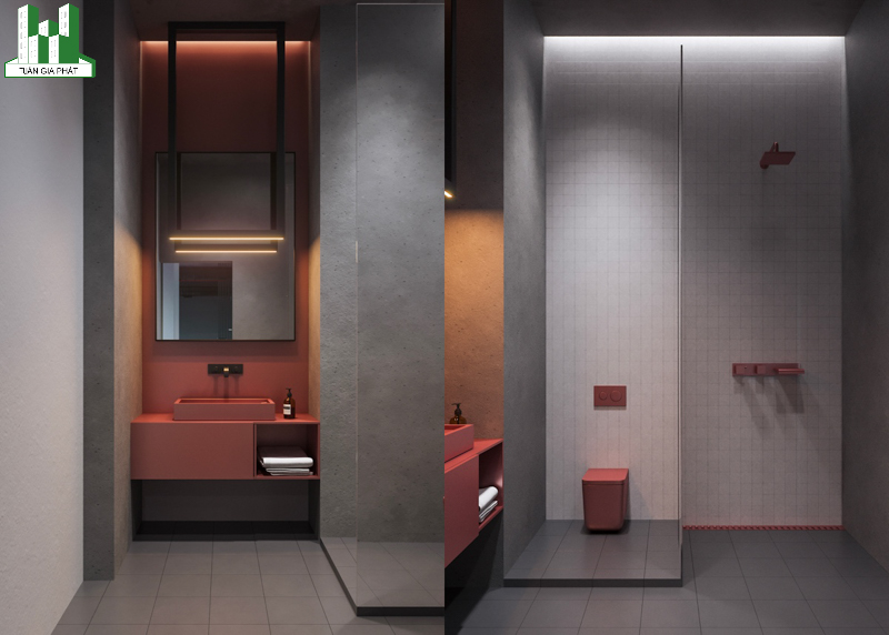 Phòng tắm với bức tường màu xám và các vật dụng nội thất màu hồng tạo điểm nhấn nổi bật