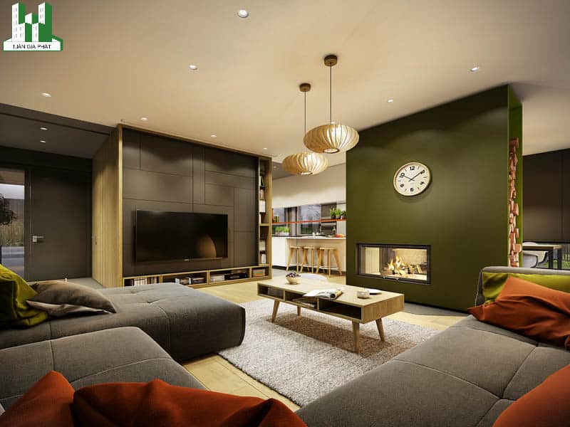 Màu xám giúp căn phòng của bạn ấm hơn khi kết hợp màu xanh oliu như thế này phải không. Ghế sofa chữ L màu xám, thảm len và hai chiếc đèn lồng phong cách Trung Hoa giúp tôn lên vẻ đẹp của cả căn nhà.