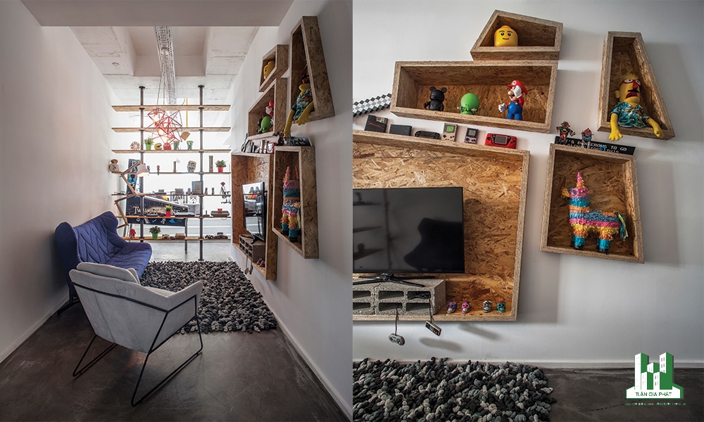 Không gian sinh hoạt chung được thiết kế rộng rãi với kệ sách lớn bằng gỗ sồi, ô kính nhìn vào phòng họp nhỏ làm không gian đầy tính nghệ thuật